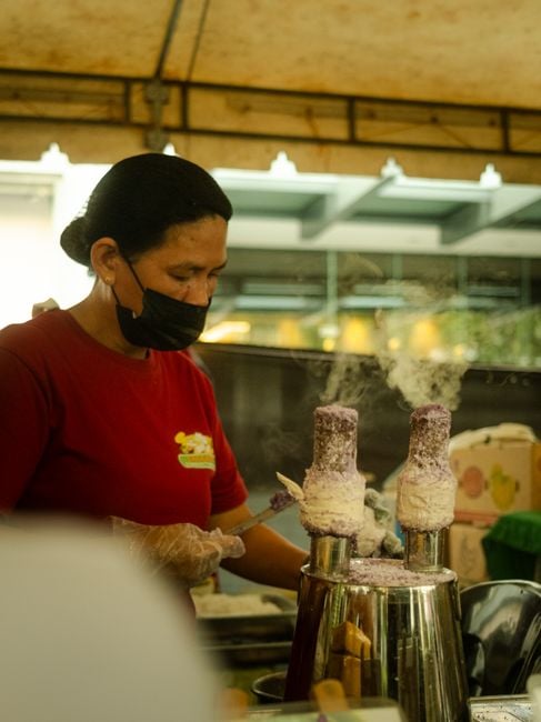 artisan ice cream maker testing flavors on laptop