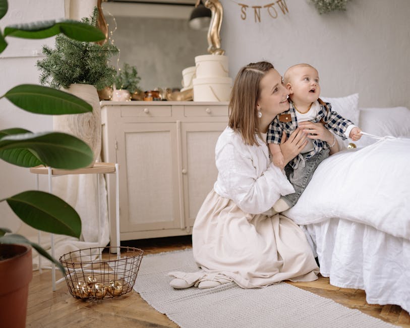parent adjusting white noise machine baby monitor nursery