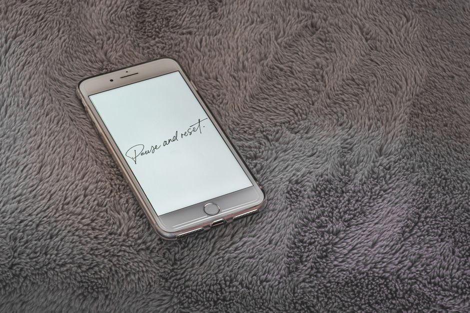 person erasing phone factory reset screen refurbished phone privacy