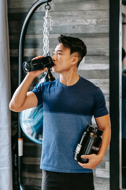 athlete taking supplement after workout creatine scoop bottle gym