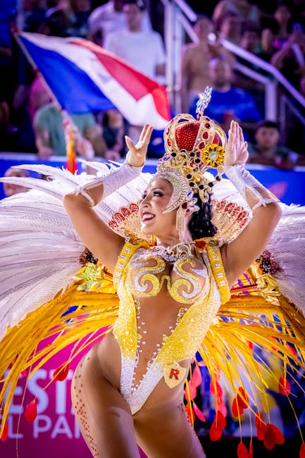 A dazzling carnival queen in vibrant costume at the Encarnación parade, Paraguay.