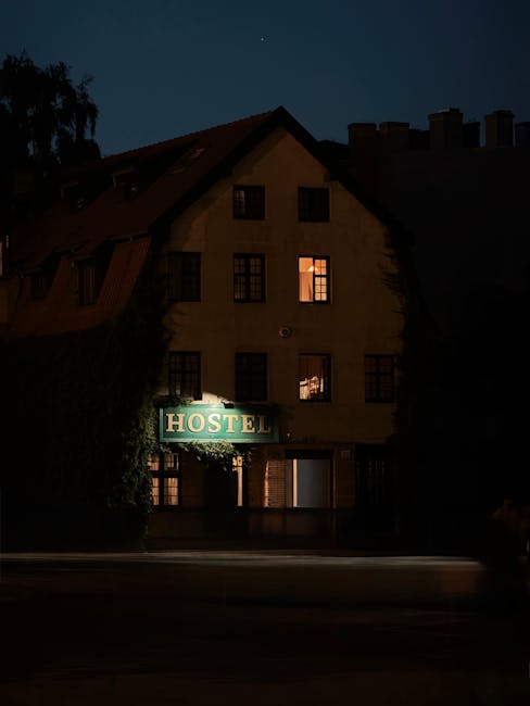A cozy hostel illuminated at night creates a warm inviting atmosphere.