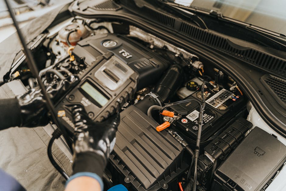 engineer inspecting EV battery pack diagnostics BMS