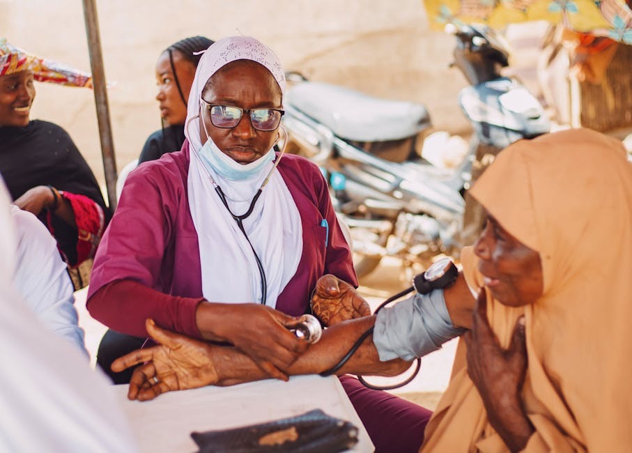 local health worker smartphone community outreach vaccine Pexels