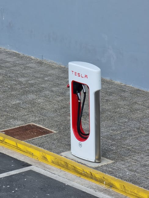 Tesla Supercharger station on a city sidewalk, ideal for promoting electric vehicle infrastructure.