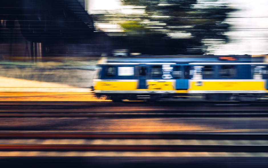 Blurred capture of a fast-moving train on Polish tracks showcasing speed and motion.