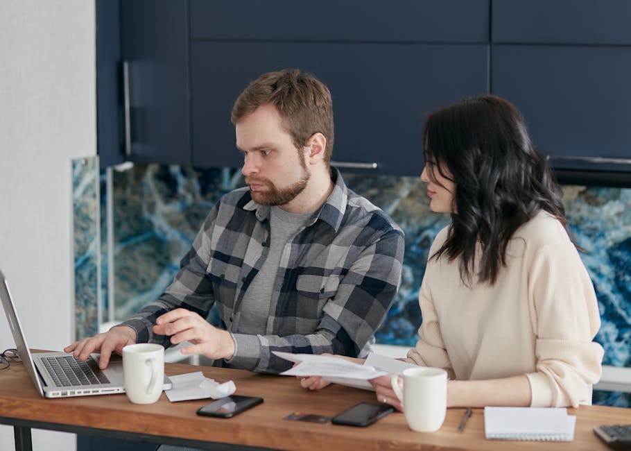 business person managing international payments on laptop
