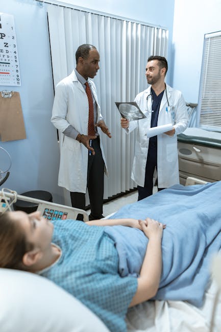 Medical professionals discussing x-ray results with a patient in a hospital room setting.