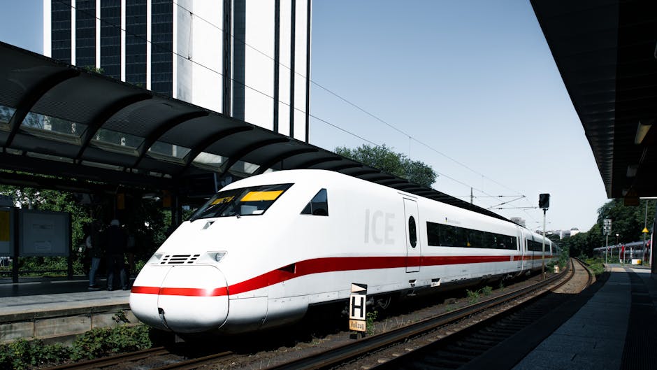 Modern ICE train at a Hamburg railway station platform, showcasing sleek design and speed.