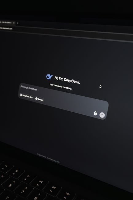 Close-up of an AI chat interface on a laptop screen in a dark setting.