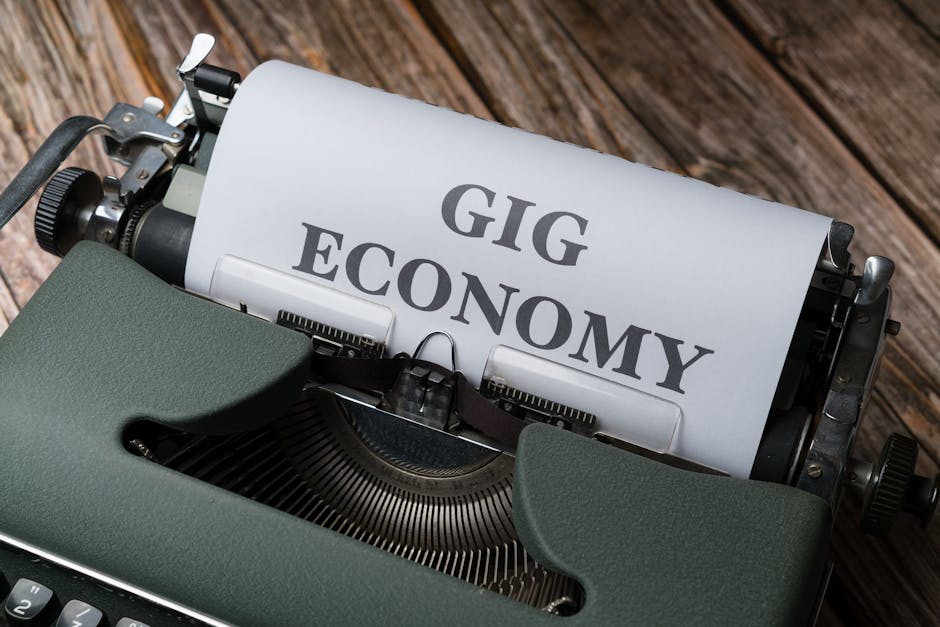Close-up of a vintage typewriter with 'Gig Economy' typed on paper, showcasing modern work trends.