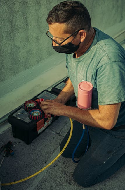 A technician kneels outdoors, performing HVAC maintenance using specialized tools, enhancing system performance.