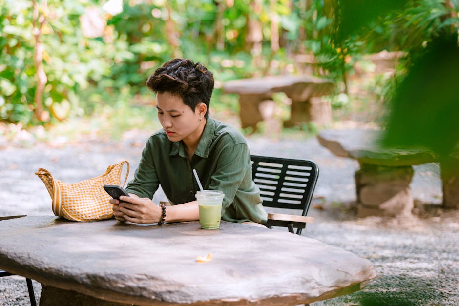teen reading outdoors phone in bag healthy digital detox