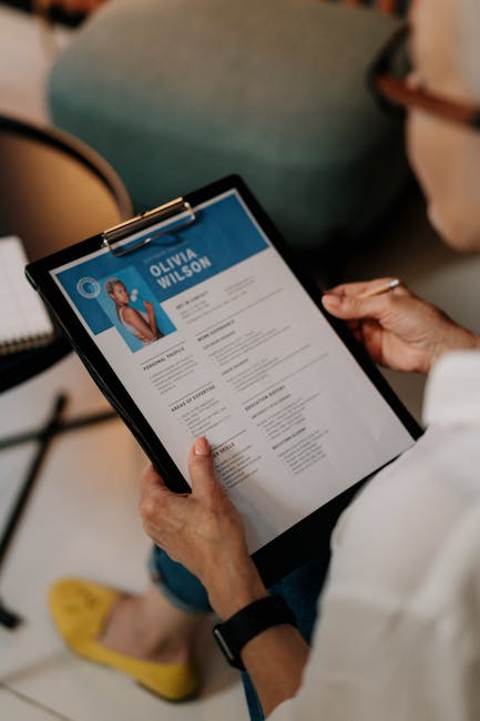 professional Arab woman reading resume office