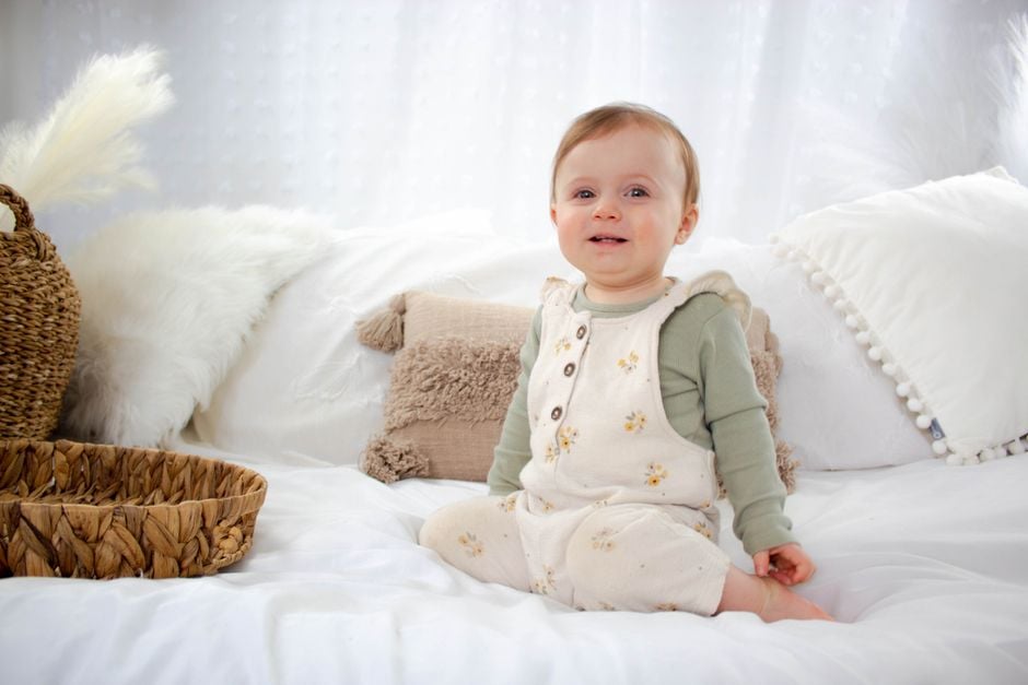organic baby cotton onesie close up cotton bolls baby onesie