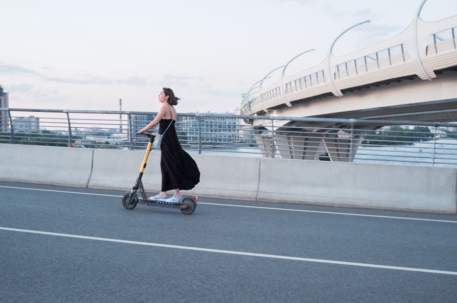 young adult riding electric scooter city crosswalk