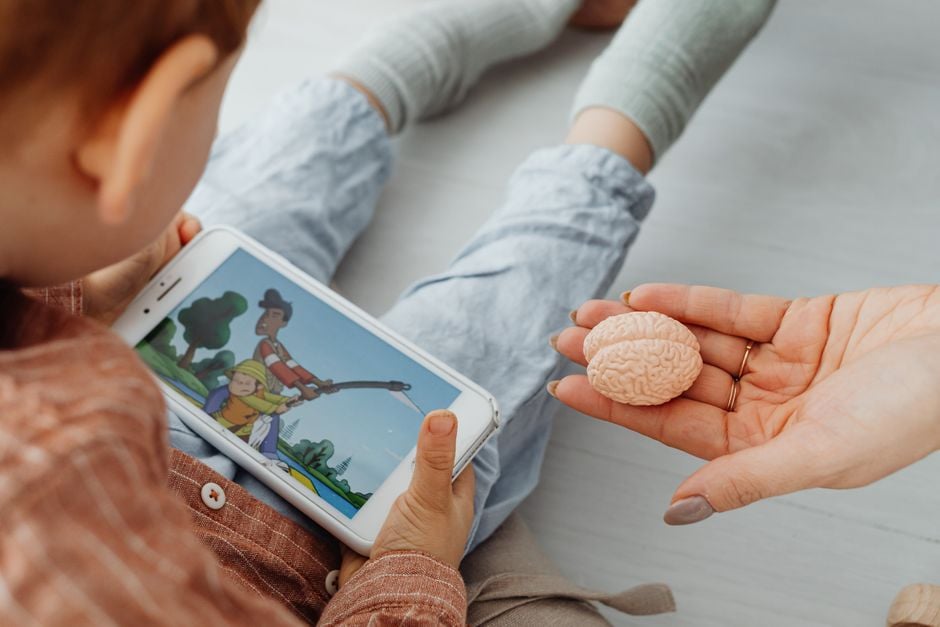 parent checking smart toy privacy settings mobile app child pexels