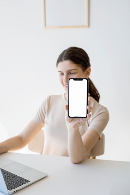 smartphone showing Arabic Flutter app developer desk