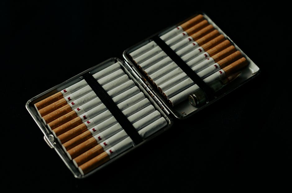 Cigarette case open with several cigarettes inside on a dark background, conveying a moody and dramatic tone.