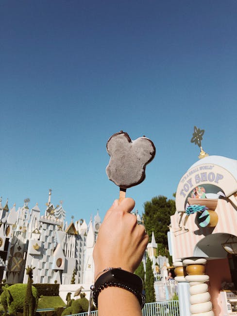 Enjoy a sunny day at Disneyland Anaheim with a tasty Mickey ice cream in hand.