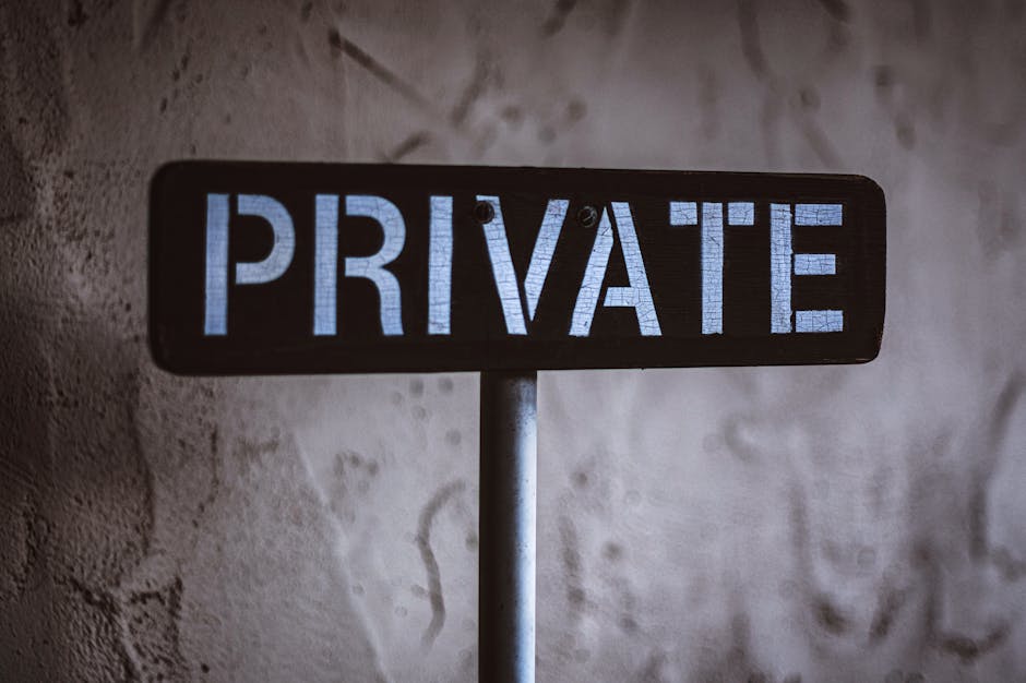 A weathered 'Private' sign on a rustic wall background in Solvang, California.