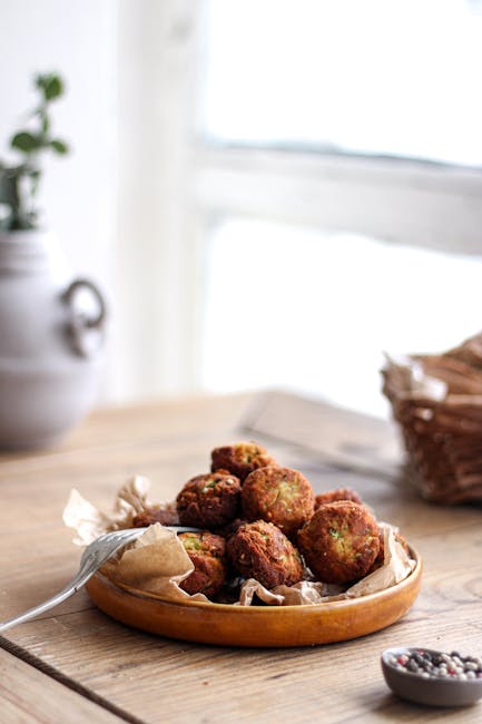 A close-up of crispy, homemade falafel served in a cozy kitchen setting, perfect for culinary inspiration.
