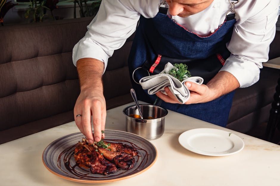 emirati chef plating traditional dish modern presentation Dubai restaurant