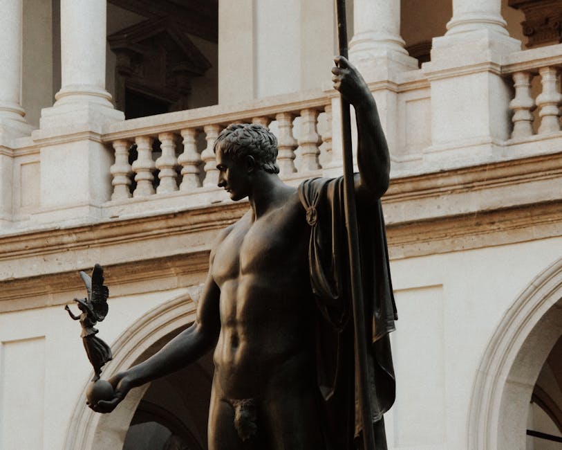 Elegant Roman statue in an Italian architectural courtyard setting.
