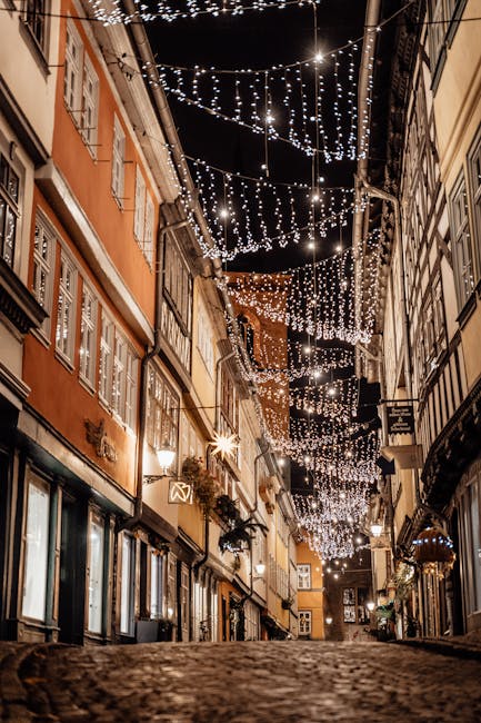 Cozy street in Erfurt, Germany, adorned with beautiful festive lights at night.