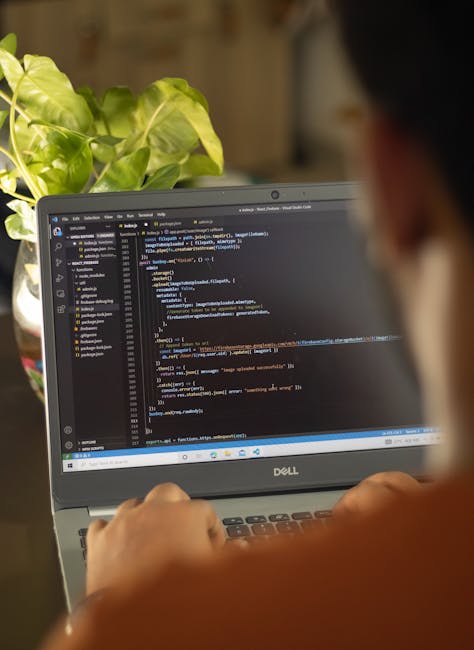developer typing TypeScript Deno laptop terminal