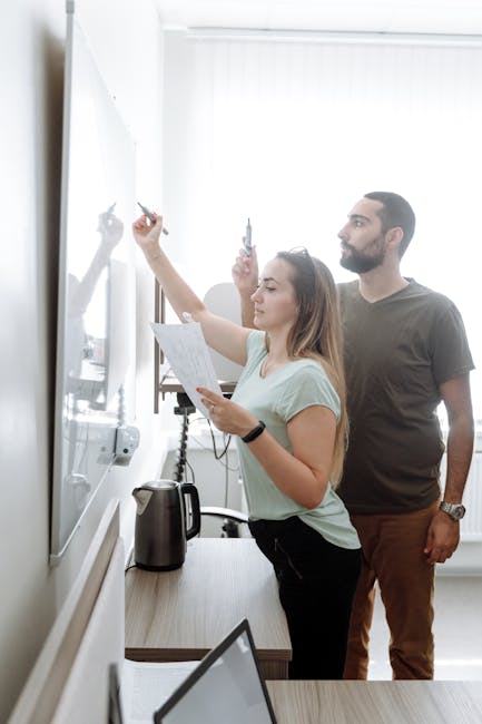 indie game developers brainstorming whiteboard studio