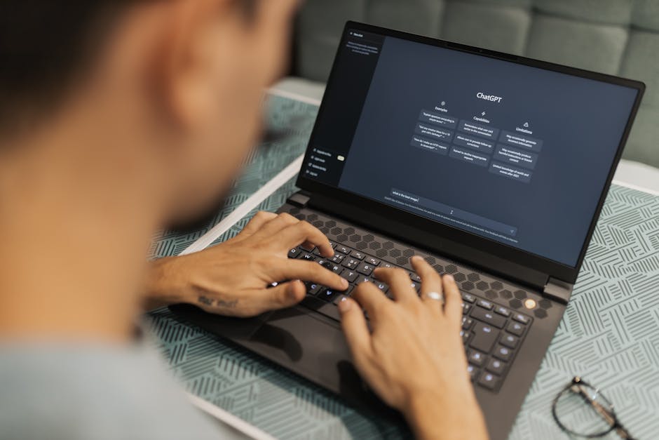 Arab developers testing AI chatbot on laptop in coworking space, startup