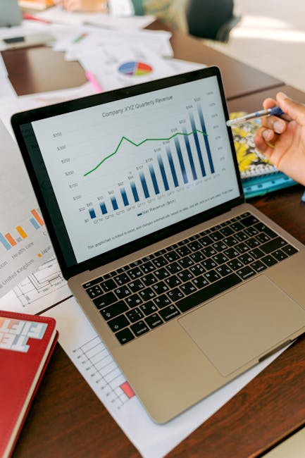 modern Dubai hotel revenue meeting laptop charts
