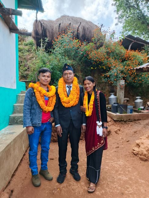 Nepali family making eco friendly diyas and marigold garlands at festival market