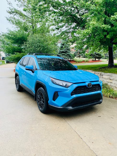 family compact car charging at home driveway