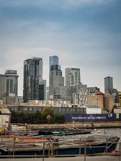 A stunning view of Canary Wharf skyline in London, showcasing modern architecture and waterfront developments.
