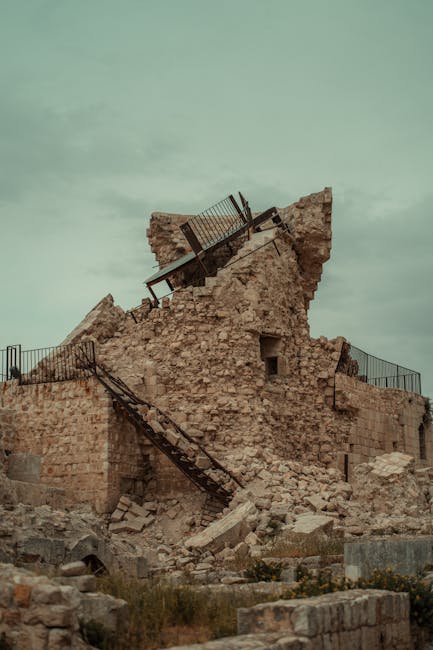 A dramatic capture of a ruined ancient fortress in Aleppo, Syria, showcasing historical architecture.