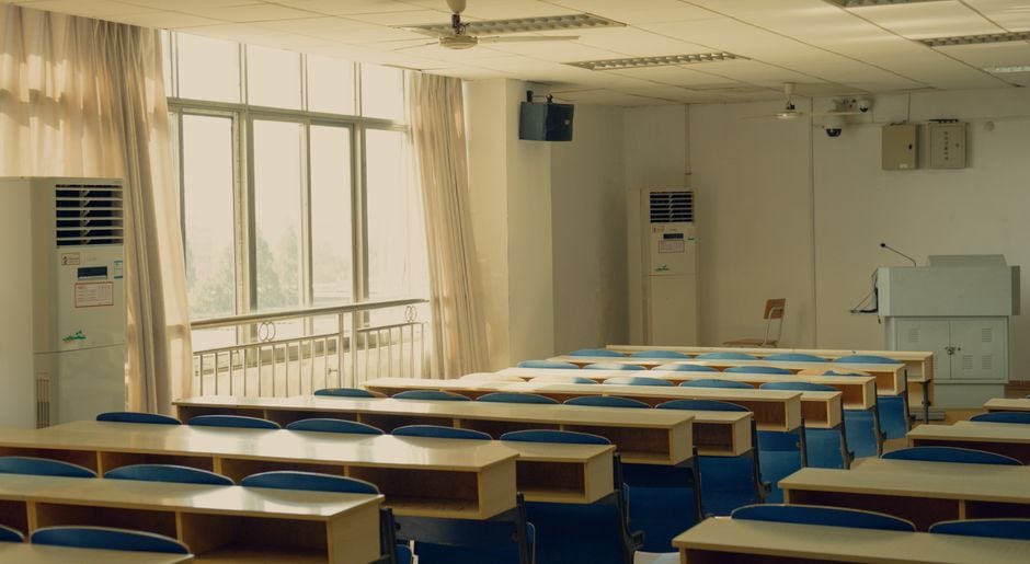 small portable air conditioner next to student desk