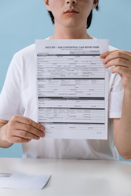 Person holding a confidential HIV/AIDS case report form in a controlled setting, emphasizing health awareness.
