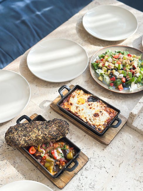 Delicious Mediterranean dishes on a rustic table setting, perfect for dining inspiration.