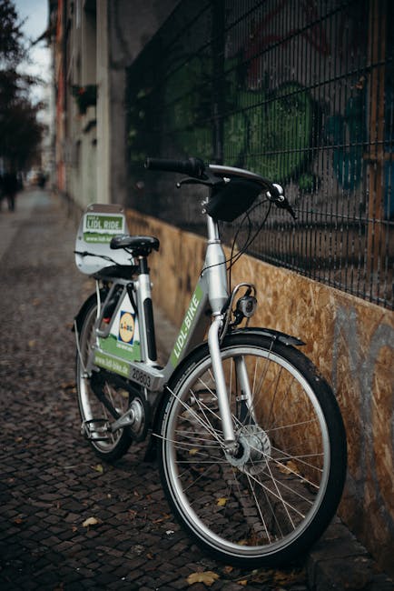 A rental bike on a brick road in Berlin city, perfect for urban transport.