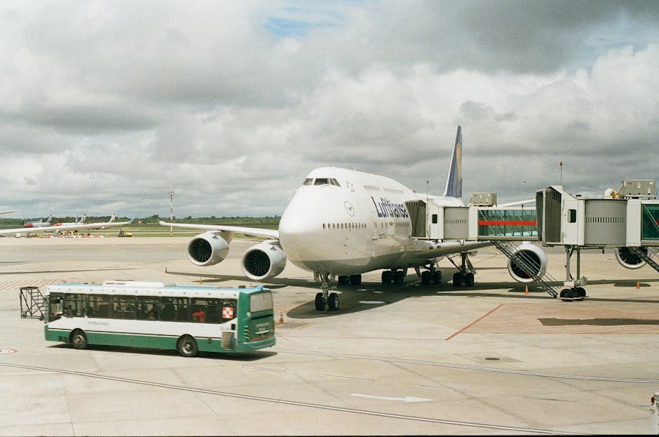 football team bus airport players boarding kitbags travel
