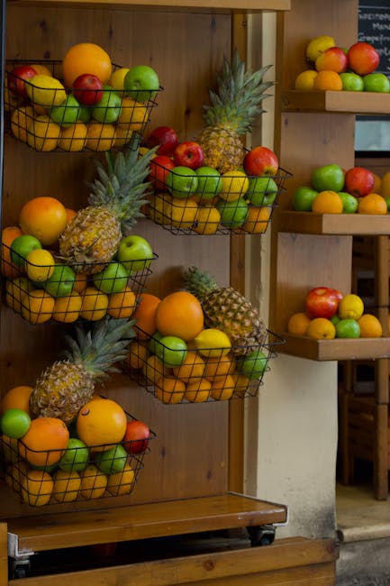 Vibrant baskets of assorted fruits on display at a market in Greece.