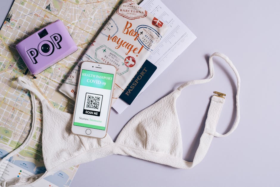 traveler researching TikTok on smartphone with map and passport flat lay