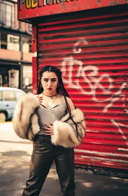 Stylish portrait of a woman in fur jacket against graffiti backdrop, urban vibe.
