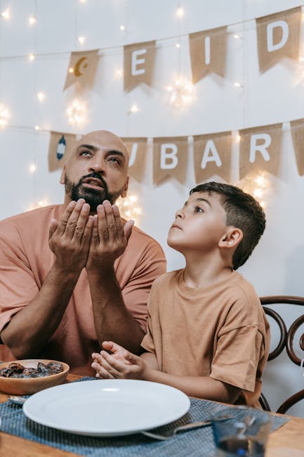 Father and son praying during Eid celebration, symbolizing faith and family connection.