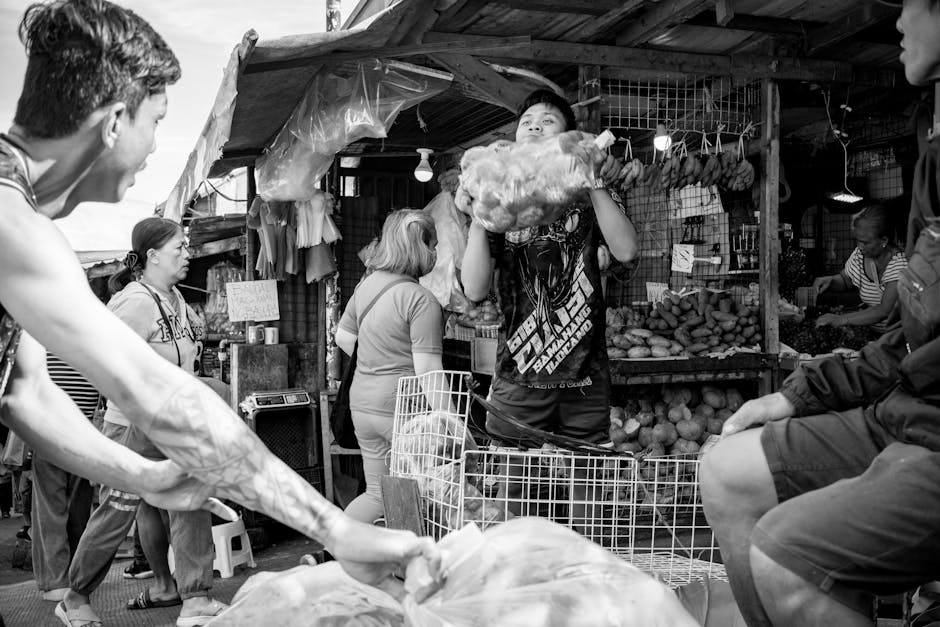 Vibrant marketplace filled with shoppers and vendors interacting. A snapshot of daily life.