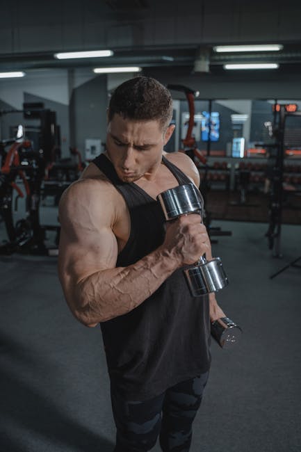 man lifting weights gym creatine supplement jar training program