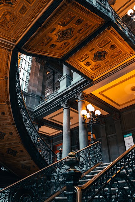 Ornate staircase and detailed ceiling in a historic Mexico City landmark.