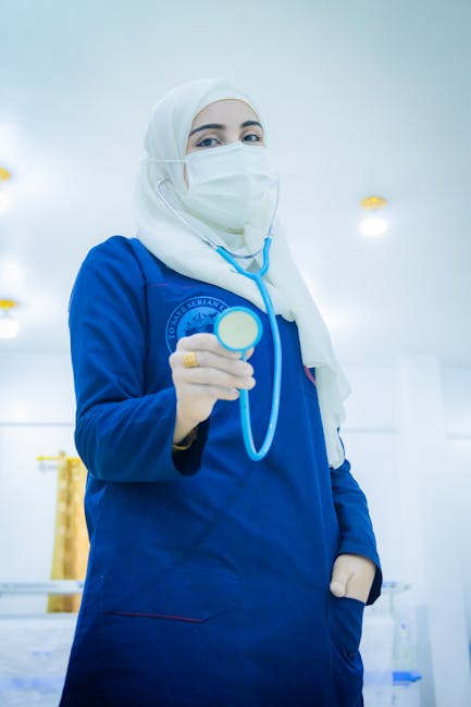 A Middle Eastern female doctor wearing a hijab in a hospital setting, symbolizing medical care in Syria.